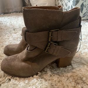 Tan, never worn, faux suede w/ a 2 1/2 in. booties